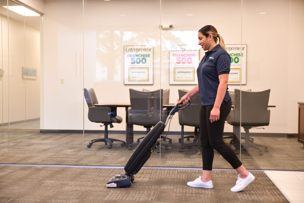 employee vacuuming 