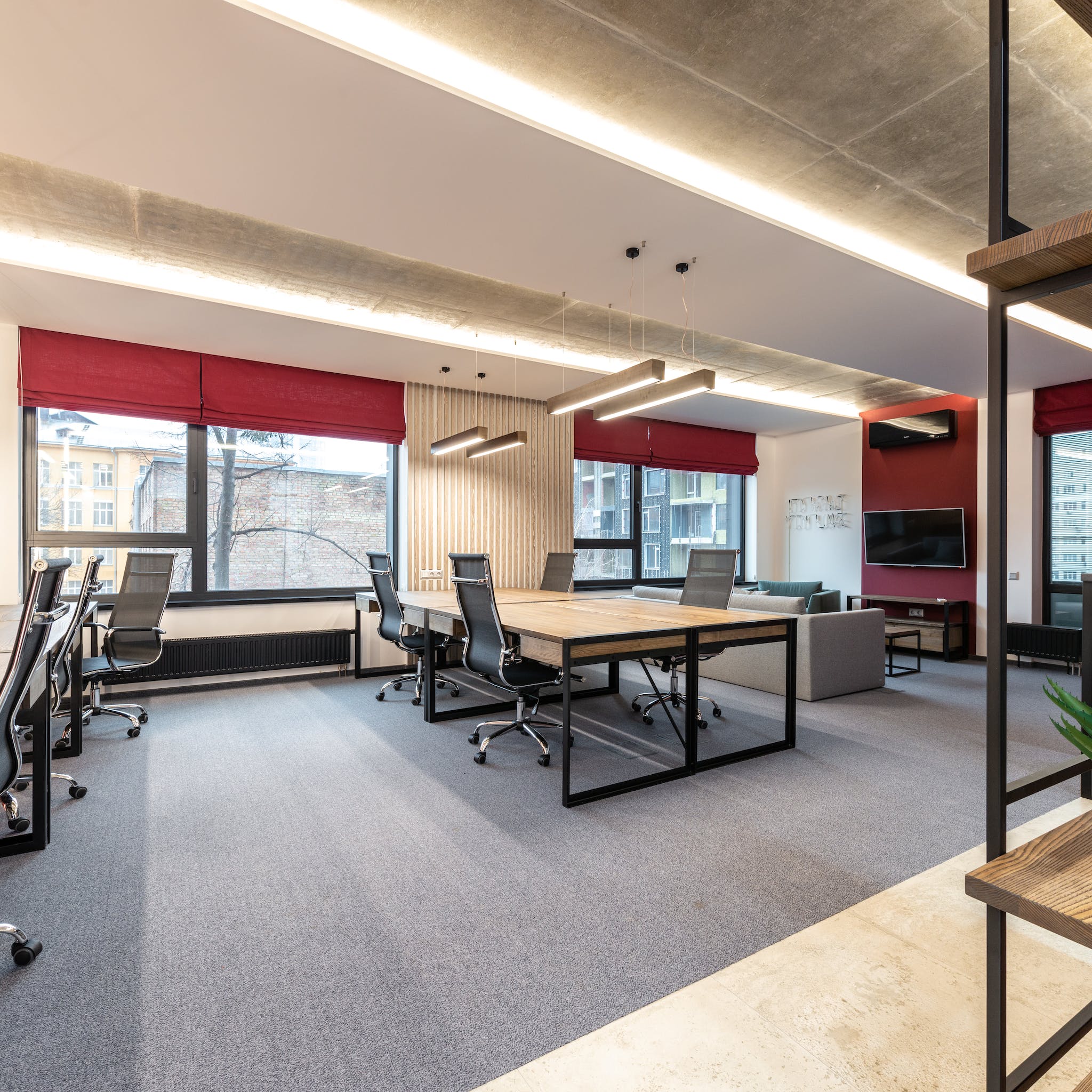 Office with tables and chairs near windows